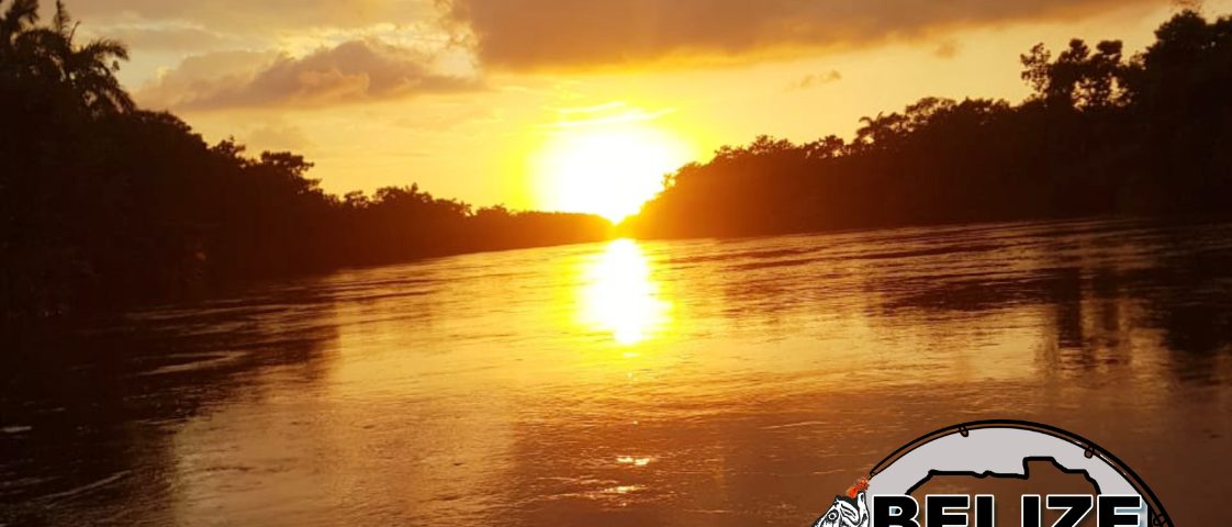 sunset over water with stamp of Belize River Lodge logo