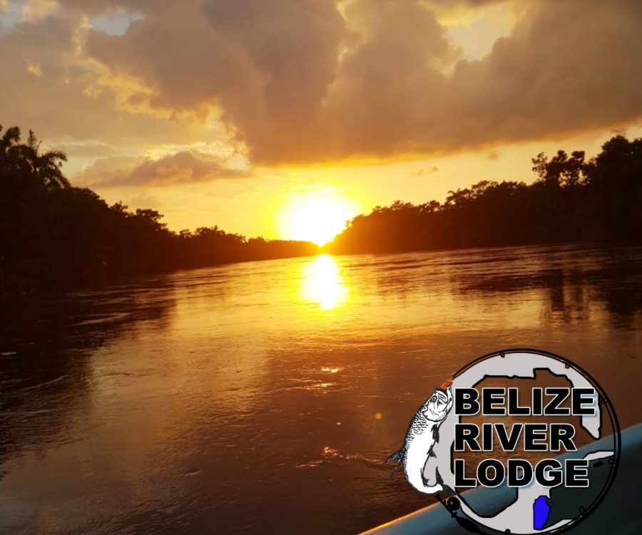 sunset over water with stamp of Belize River Lodge logo